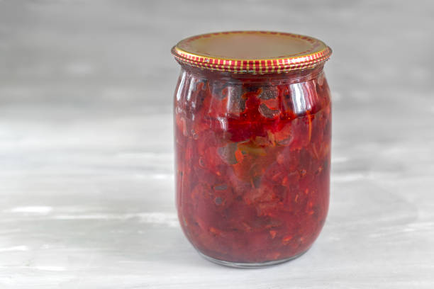istock Home canning: canned beetroot with vegetables for borscht. 1439812475
