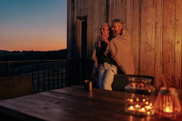 istock Romantic senior couple evening in nature. 1439813009