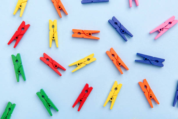 istock Formation of objects, repetitive group of clothespin colorful pattern, crowd top view 1439813032
