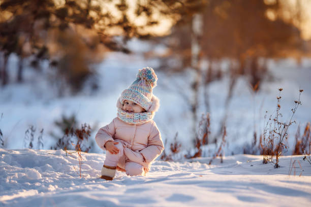 istock Charming little girl in a warm coat. 1439813870