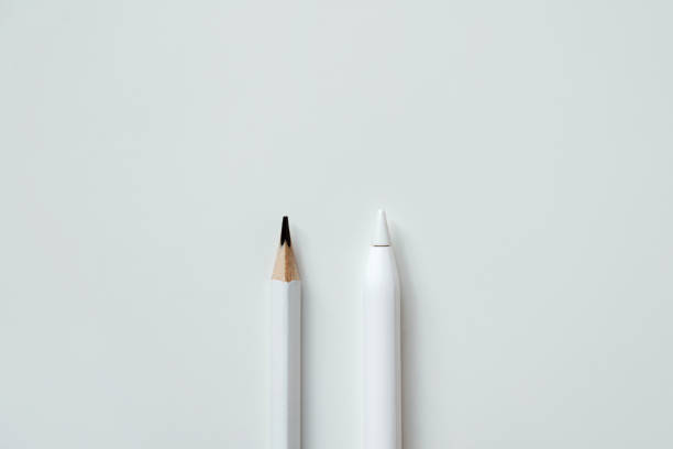 istock electronic stylus and wooden plain pencil, technology development concept and new generation 1439814471
