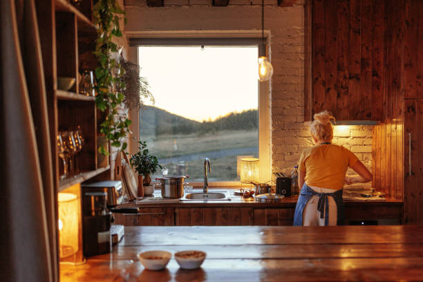 Woman  cooking in modern kitchen.