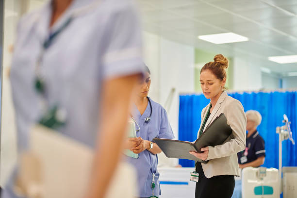 istock hospital administrator with ward doctor 1439816065