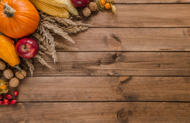 istock Autumn or fall flat lay composition for Thanksgiving or Halloween, with copy space on wood. 1439816508