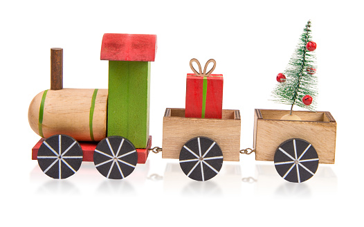 Christmas Toy Train Carrying a Gift Box and a Christmas Tree