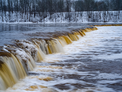 Venta Rapid (Ventas rumba), waterfall on Venta River in Kuldiga, Latvia. Widest waterfall in Europe at winter.