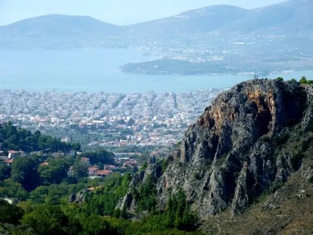 Top view of Volos city, featuring rocky cliffs from mount Pelion.