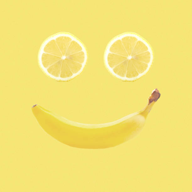 istock Contemporary art collage. Smiling banana and lemon. 1439818608