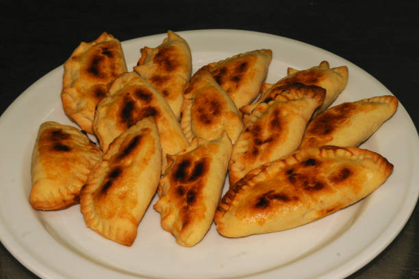 istock Cooking some meat empanadas in olive oil. 1439820234