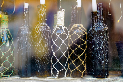 Wine bottles are covered with drops of candle wax