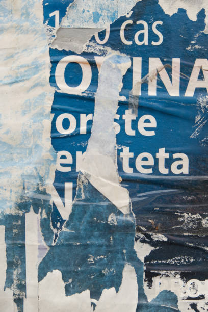 istock Old torn street poster background with text 1439823494