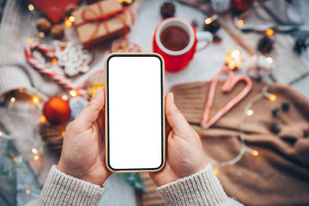 Mock up phone with place for your text on a cozy christmas background. stock photo