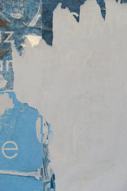 istock Old torn street poster background with text 1439823626