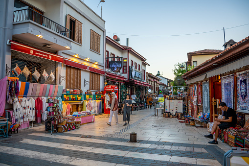 Antalya, Turkey - September 10, 2022: People walking in street in the Historic part of Antalya - Kaleici, Turkey. Old town of Antalya is a popular destination among tourists.