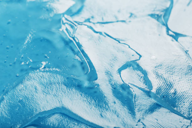 istock Antiseptic gel on a blue background in waves. 1439824735