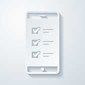 istock Smartphone with checklist. Icon with paper cut effect on blank background 1439827110
