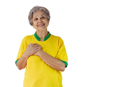 Mature Woman with Soccer Team Yellow Shirt Isolated on White. Sport Fan With Flag Celebrating the Cup.