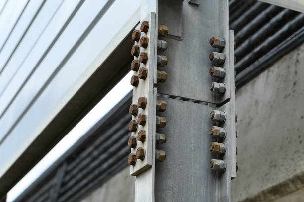 istock Joint of steel structure with bolt and nut at construction site 1439831256