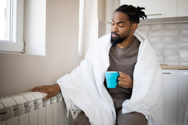 istock Man feel cold in home with no heating 1439832553