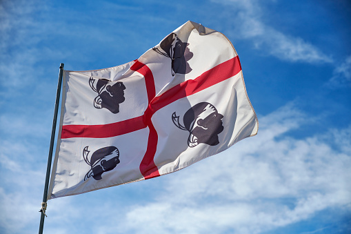 The flag of sardinia also known as the Flag of the Four Moors.