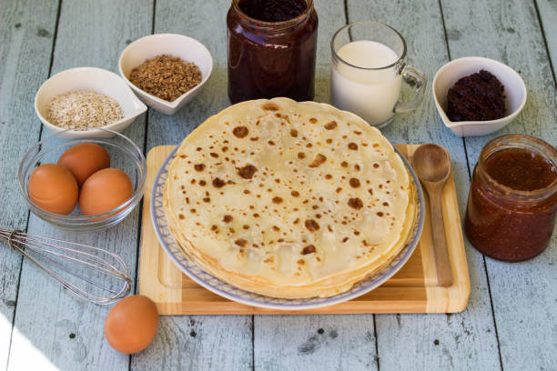 istock Ingredients for pancakes and thin pancakes 1439835424