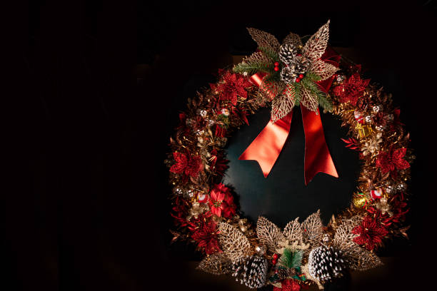 Christmas Wreath with red sound wave graphic equalizer bars and flying musical notes against black background.