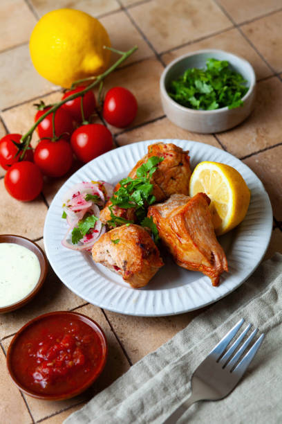 istock Grilled chicken kebab with vegetables and greens 1439838752