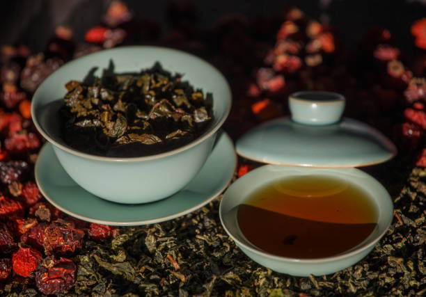 istock Gaivan and bowls with green tea and tea leaves. 1439840140