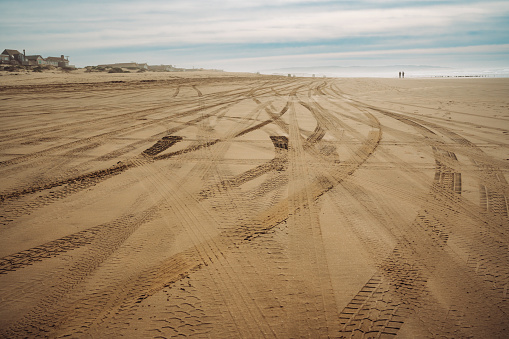 Tire tracks on sandy beach. Oceano Dunes, California Central Coast, the only California State Park that allows  vehicles to drive on the beach