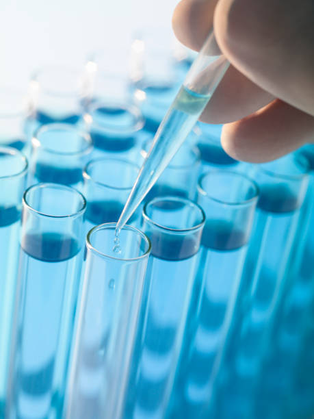istock Droplet Falling from Pipette into Test Tube 1439843853
