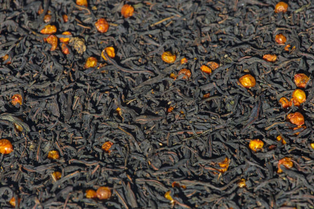 istock Dried tea leaves and berries background. 1439846134