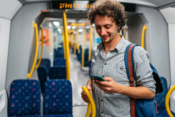 istock Young Man Using Phone In A Subway Train In Stockholm 1439846194