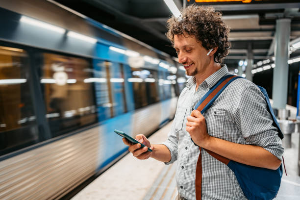 istock Young Man Using Phone While Waiting For A Subway Train In Stockholm 1439846358