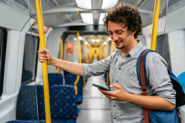 istock Young Man Using Phone In A Subway Train In Stockholm 1439846388