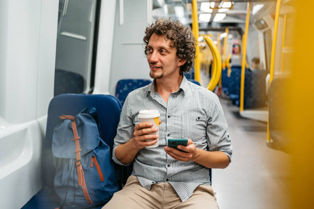 istock Young Man Using Phone In A Subway Train In Stockholm 1439846674