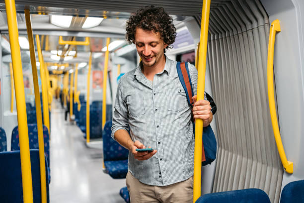 istock Young Man Using Phone In A Subway Train In Stockholm 1439846753