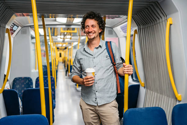 jovem andando em um trem do metrô em estocolmo - coffee sack bag espresso - fotografias e filmes do acervo