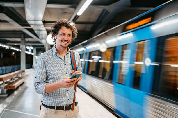 istock Young Man Using Phone While Waiting For A Subway Train In Stockholm 1439846953