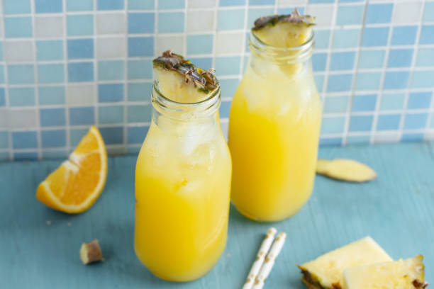 istock Tropical fruity drink with pineapple and orange 1439847099