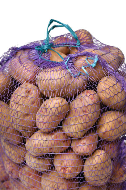 istock a bag of potatoes, the object is isolated on a white background 1439848298