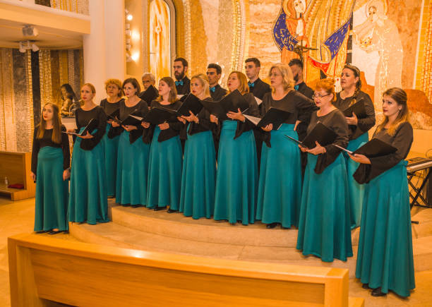 istock Choir practice before the performance holding choir books in hands 1439851537