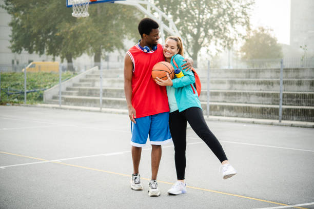 istock Friends play basketball 1439859993