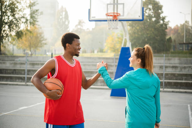 istock Friends play basketball 1439860058
