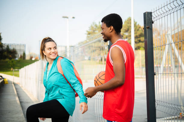 istock Friends play basketball 1439860103