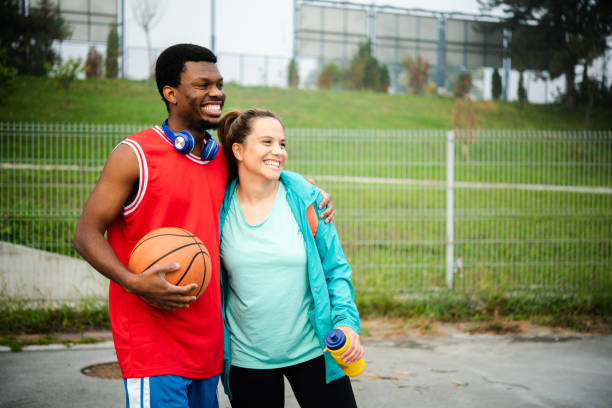 istock Young couple playing basketball 1439860126