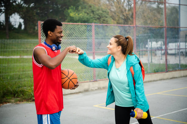 istock Young couple playing basketball 1439860137