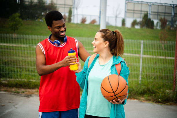 istock Friends play basketball 1439860149