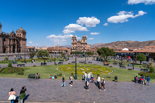 Cuzco, Peru - August 17, 2022: tourists walking in the city of Cusco