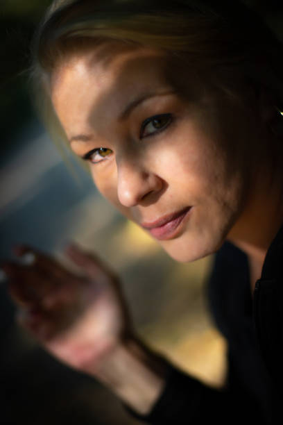 istock Pretty woman in a park 1439862411