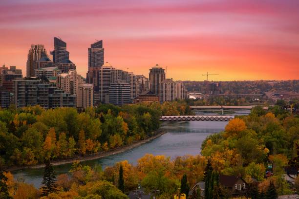 Warm Sunrise Over The Downtown Calgary River Valley stock photo